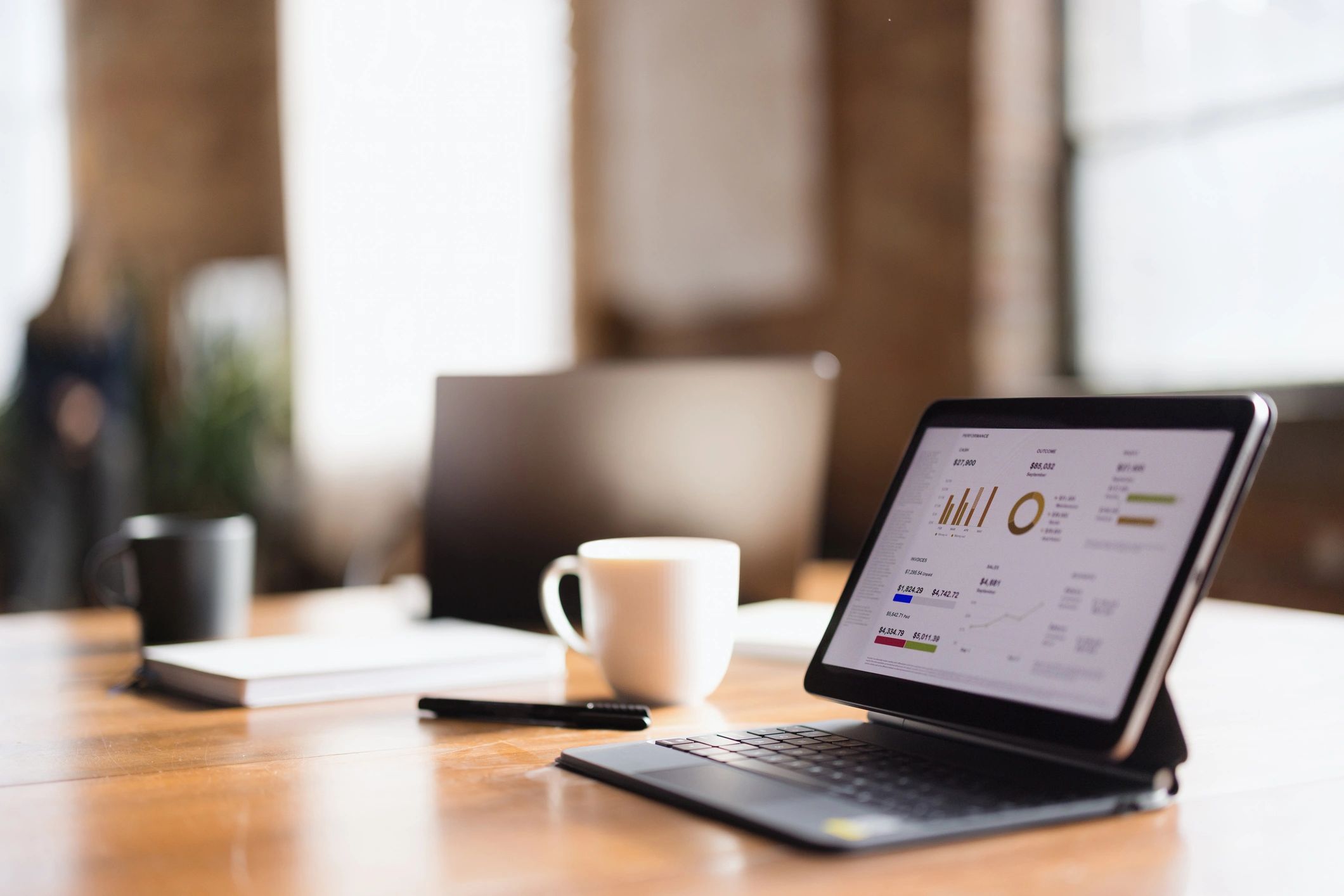 Financial chart displayed on a tablet at a desk